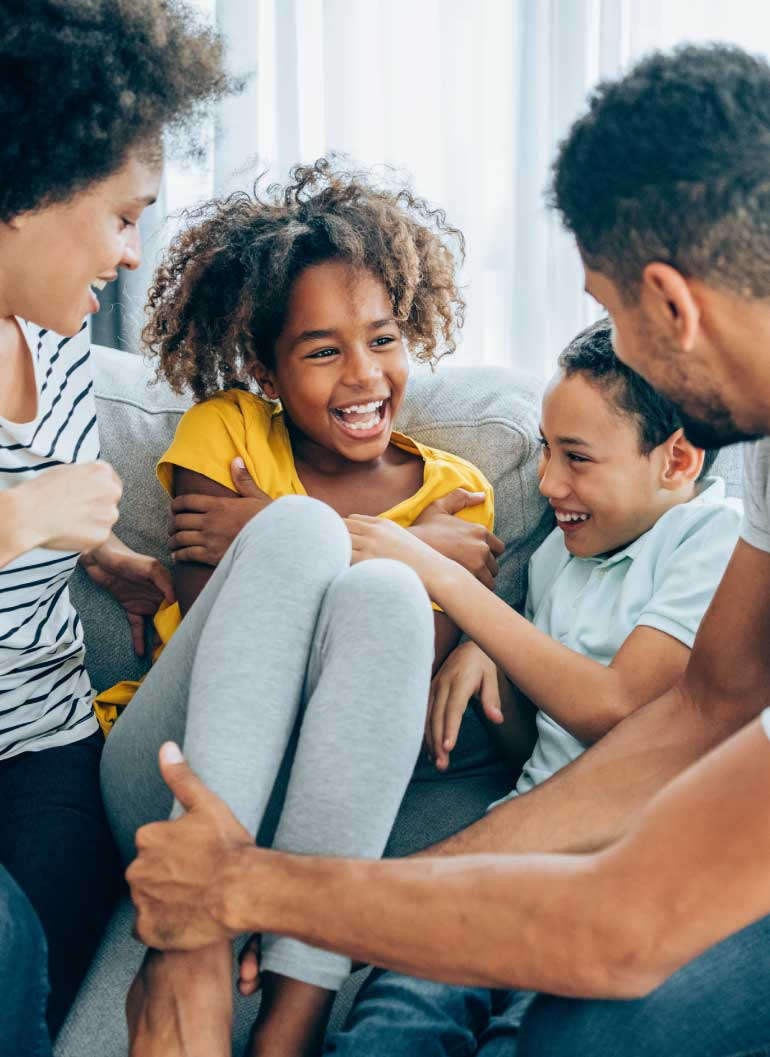 family-playing-on-couch