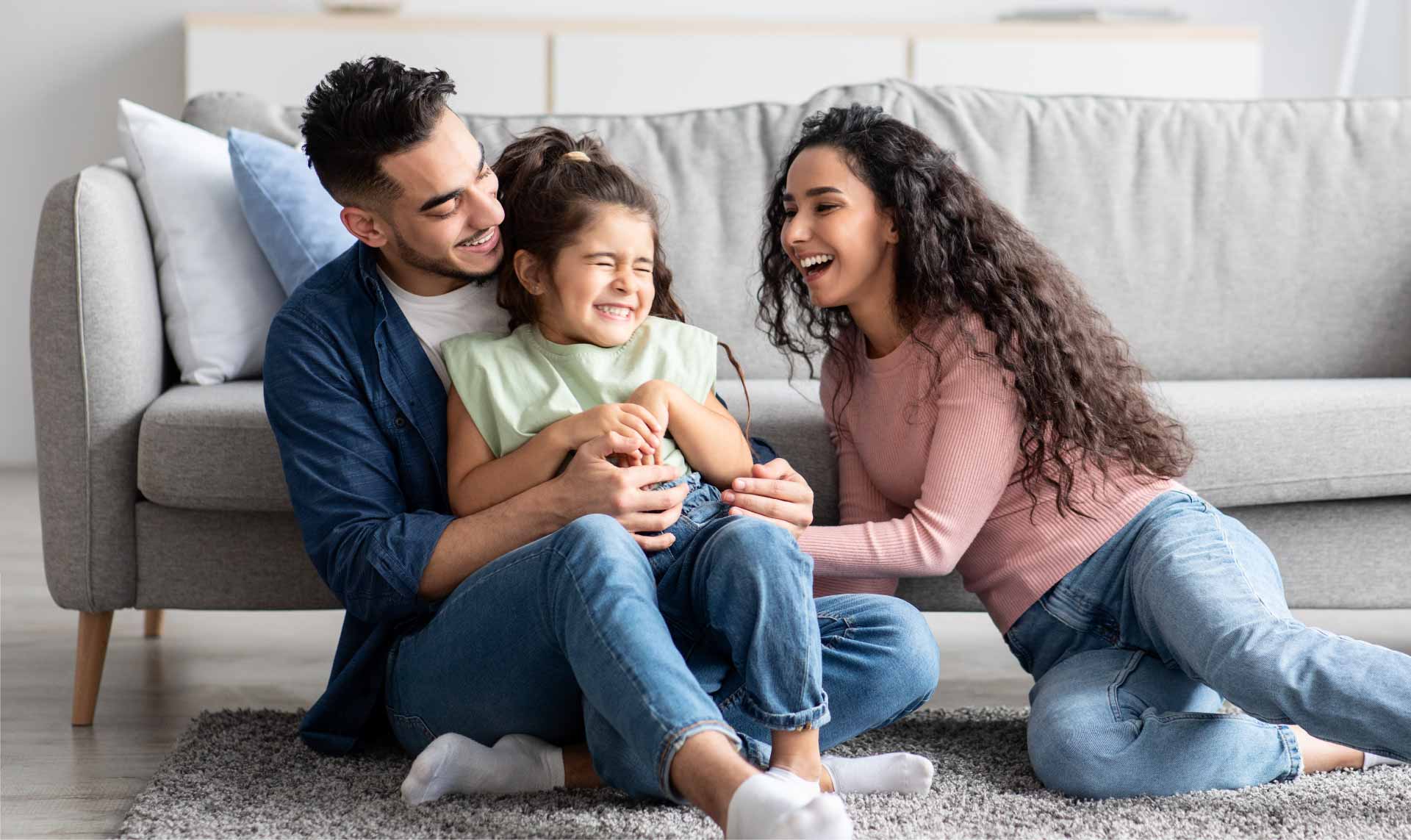 family-playing-on-floor-of-living-room