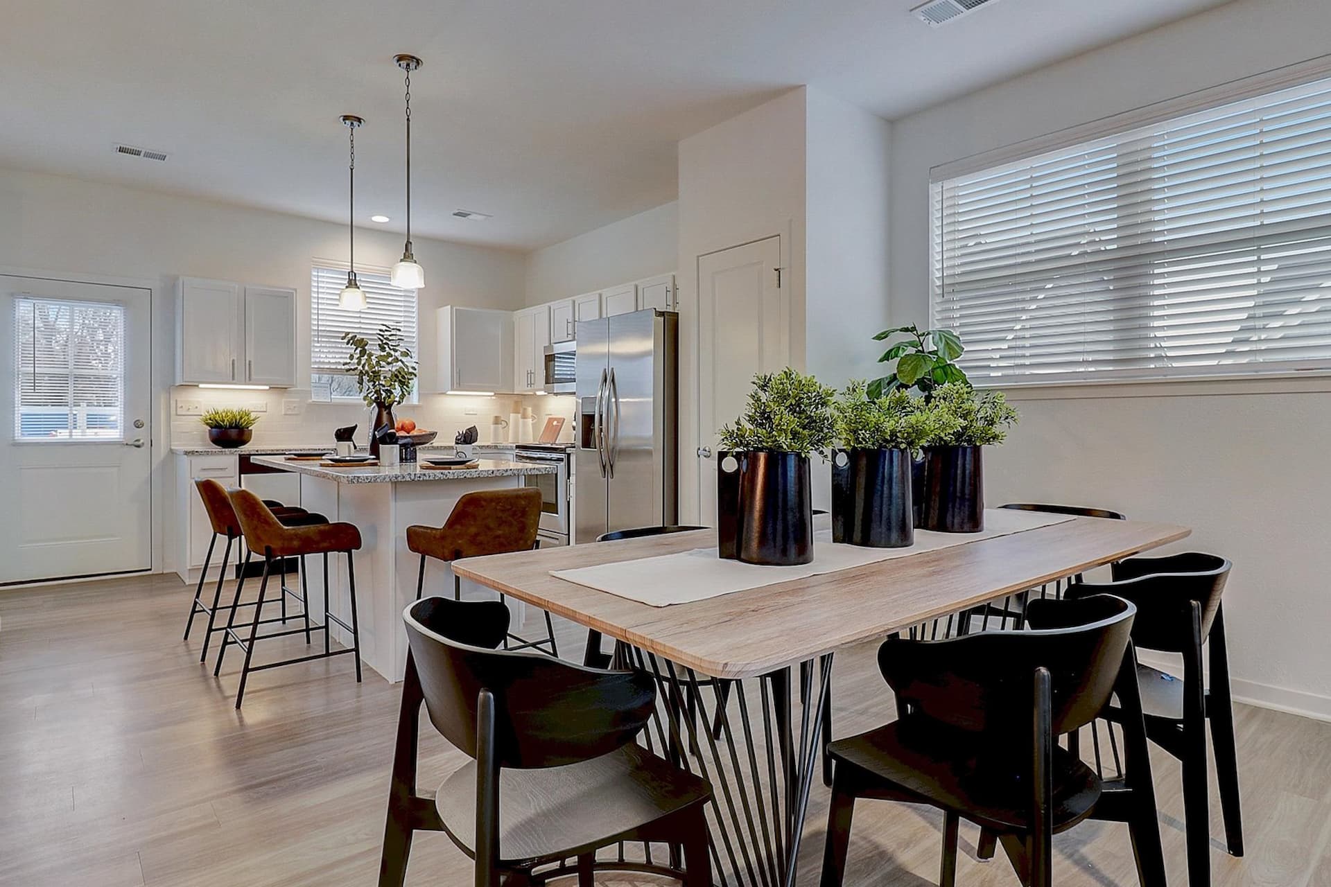 Stunning Kitchen with Granite and Stainless Steel Appliances at Avanterra Wolf's Crossing Single Family Home Rentals