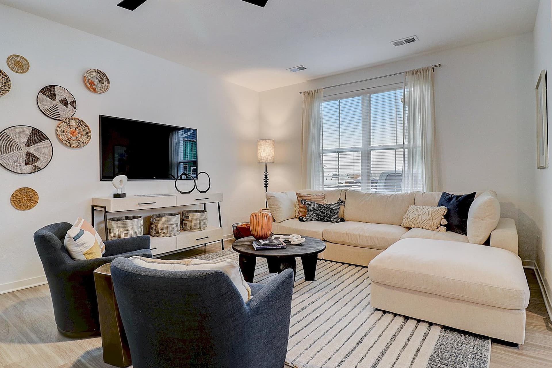 Spacious and modern living room at Avanterra Wolf's Crossing Single Family Home Rentals